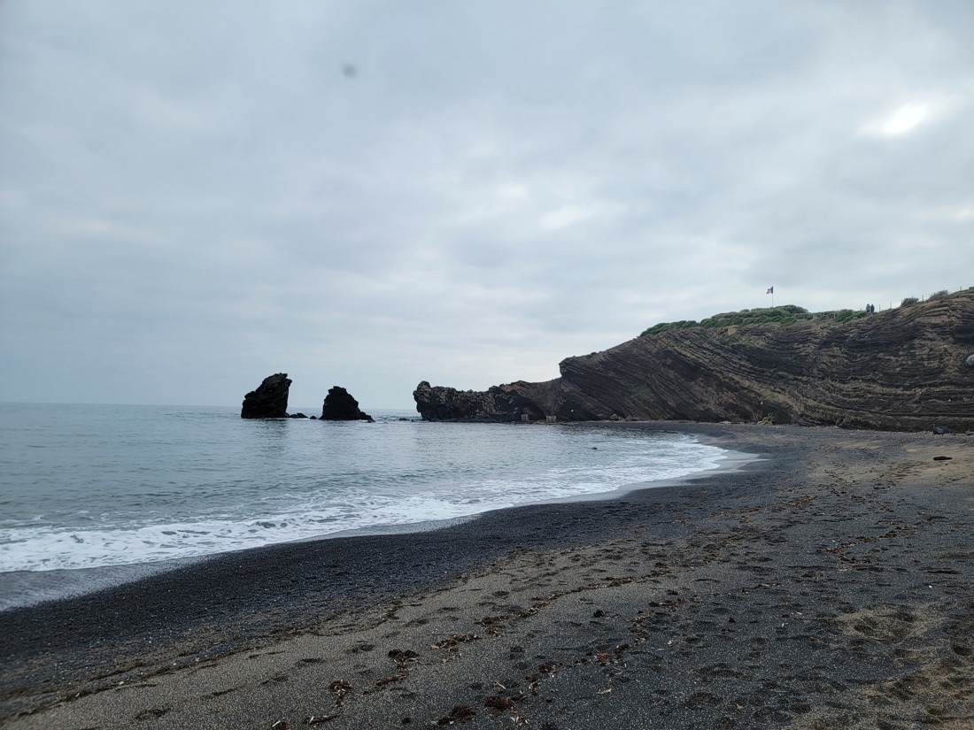 Black-basalt cove on the coast near Agde